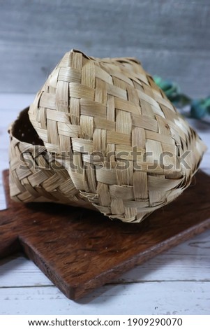 Unfocus picture of "Besek" traditional place or container made of woven bamboo, the shape of a rectangle. Isolated