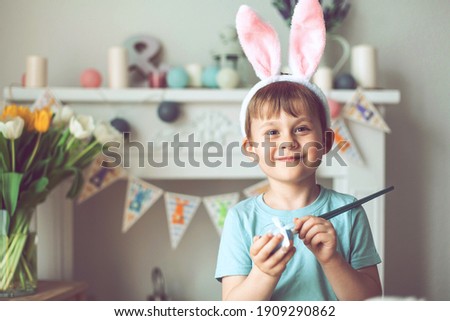 Easter. A little boy is painting Easter eggs. Easter decor. Holidays.