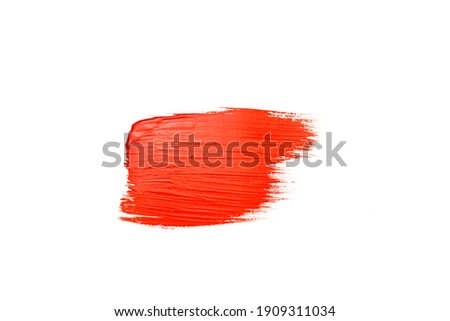 smear of red paint on a white background