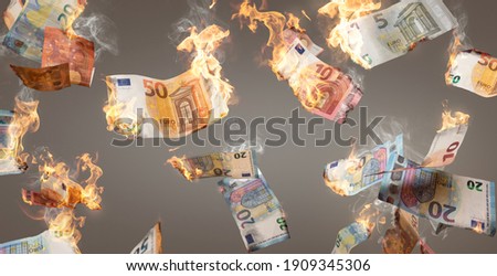 Burning Euro banknotes falling down Royalty-Free Stock Photo #1909345306