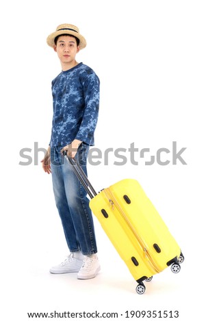 Asian tourists standing with luggage. Stylish man standing with suitcase on white. Journey, Travel concept