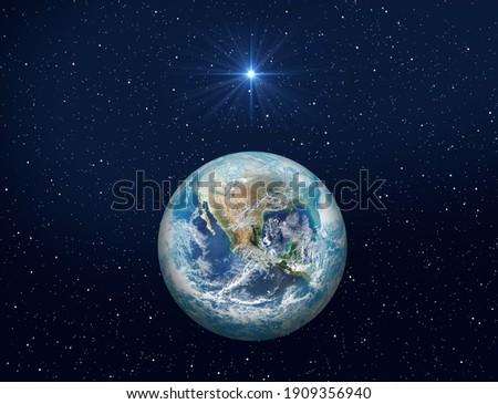 Christmas Star of Bethlehem Nativity, christmas of Jesus Christ. Planet Earth on dark blue night sky with bright star. Elements of this image furnished by NASA 