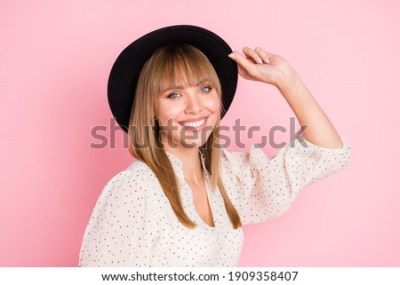 Photo of cheerful positive lady shiny smile hold hat wear vintage headwear dotted blouse isolated pink color background