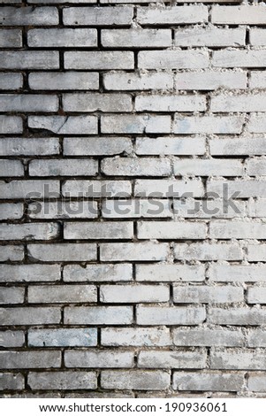 brick background, darker on the left and right brighter