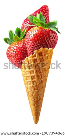 Waffle cone with strawberries isolated on a white background.