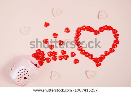Valentine's Day, composition of hearts on a pink background. View from above. Space for text, flat lay