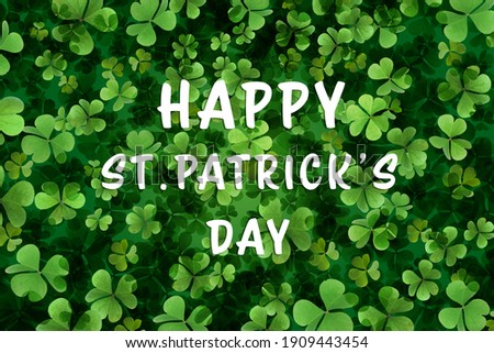 Happy St. Patrick's Day. Green clover leaves as background