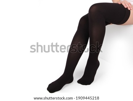 Closed toe stockings. Compression Hosiery. Medical stockings, tights, socks, calves and sleeves for varicose veins and venouse therapy. Clinical knits. Sock for sports isolated on white background Royalty-Free Stock Photo #1909445218