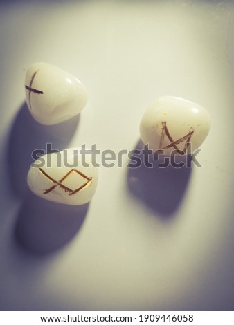 The runes are made of white stone with three letters. This picture is an article about the runes.