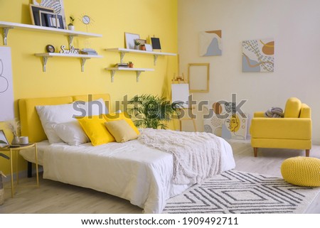 Stylish interior of modern bedroom Royalty-Free Stock Photo #1909492711