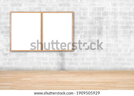 2 brown blank wooden frames for pictures and art for a modern home decoration on a brick wall.