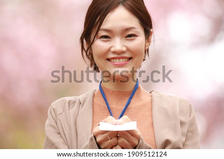 Female employees exchanging business cards