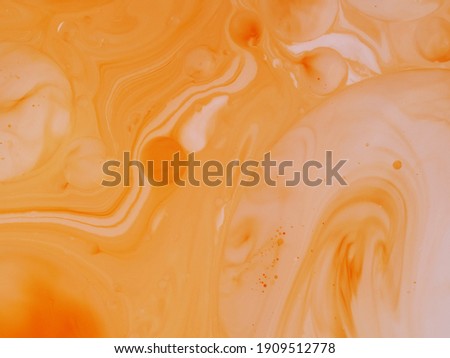 abstract background oil drops on water macro orange    