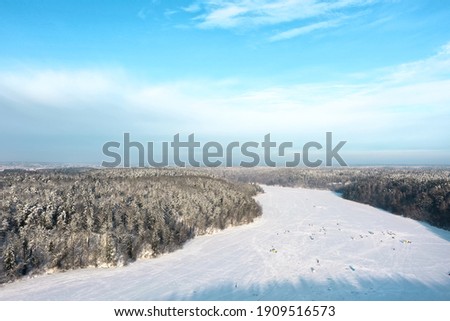 Aerial frozen lake view in the morning with cleared out sky in Vilnius above lake "Žalieji ežerai".