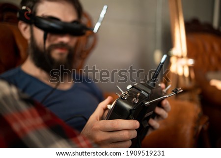 Attractive Caucasian Man Hold Joystick And Wear Virtual Reality Glasses