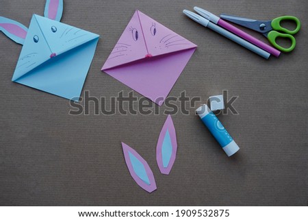 Step 8. Step by step photo instruction. DIY concept. How to make Origami paper bookmark form of bunny. Children's art project. . Easter greetings. creative ideas for kids.  a craft for children. 