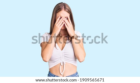 Young beautiful blonde woman wearing casual white tshirt rubbing eyes for fatigue and headache, sleepy and tired expression. vision problem 