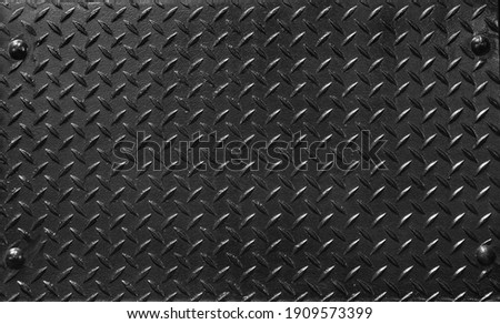 steel background plate with fluted metallic texture in black color