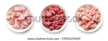 Set of raw cut chicken fillet, pork and beef meat isolated on white background, top view Royalty-Free Stock Photo #1909624669