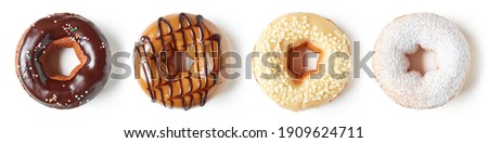 Set of dark and white chocolate donuts isolated on white background, top view