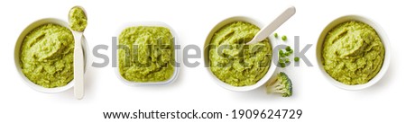 Set of green peas and broccoli baby puree in bowl and plastic container with baby spoon isolated on white background, top view Royalty-Free Stock Photo #1909624729