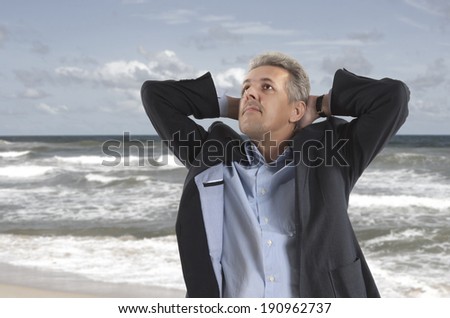 Free and relax of businessman under blue sky