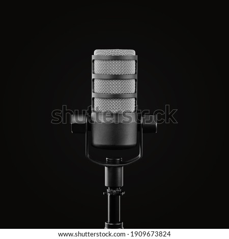 Podcast microphone on a tripod, a black metal dynamic microphone on an isolated black background, for recording podcast or radio program, show, sound and audio equipment, technology, product photo, DJ