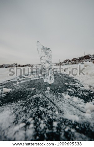 Ice sculpture on the a frozen lake vertical