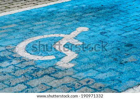 Blue painted parking space reserved for handicapped