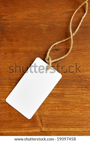 Blank tag over wooden background, place your own text here