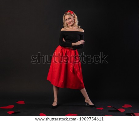 Girl standing around cardboard hearts love valentine background, flirting design, on the floor hearts wedding. the formula for the occasion. event festive, frame in red dress girl, barefoot