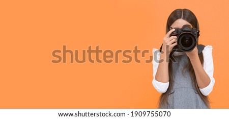 teen girl taking photo. kid use digital camera. child photographing. school of photography. hobby or future career. photographer beginner with modern camera. making video. childhood. copy space. Royalty-Free Stock Photo #1909755070