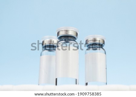 Vaccine three jars, drugs mockup. on a blue background. copy space, banner