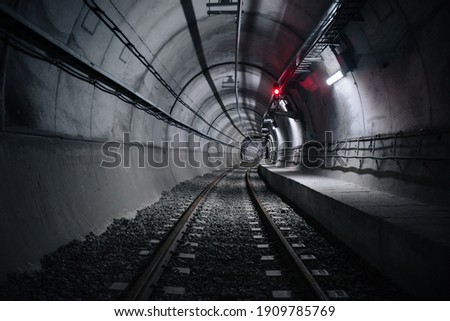 lights and shadows in railway tunnel Royalty-Free Stock Photo #1909785769