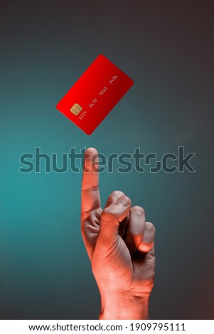 Close up male hand point to levitating template mockup bank credit card with online service isolated on green background