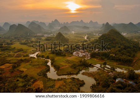 Sunset landscape of Guilin, Li River and Karst mountains. Located near Yangshuo County, Guilin City, Guangxi Province, China. Royalty-Free Stock Photo #1909806616