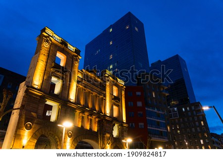Facade of an old building and skyscrapers in the background in Bilbao city of Bizkaia province of the Basque Country in Spain, Europe
