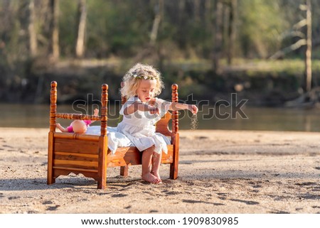 A gorgeous young girl enjoys a spring day outdoors