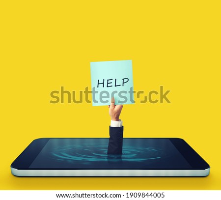 Man is sinking into a smartphone display and asking for help with a sign