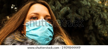 Covid epidemic background with woman in mask. Banner concept with woman in park