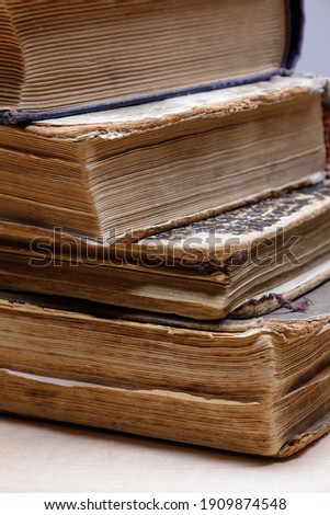 Big old book pages close up on corner low depth of field, vintage paper texture. selective focus. High quality photo