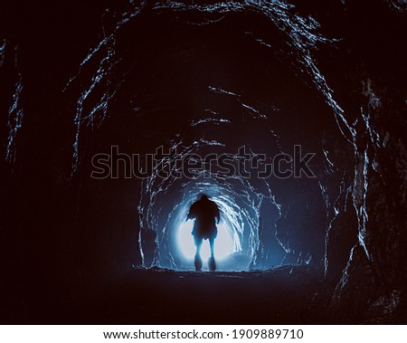 surreal moody photo of the man in the cave