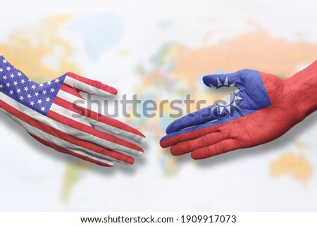 Taiwan and USA - Flag handshake symbolizing partnership and cooperation with the United States of America Royalty-Free Stock Photo #1909917073