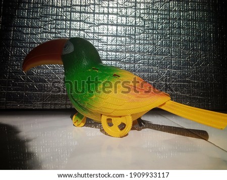 Plastic bird shaped children's game