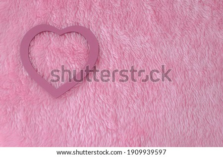 Pink heart on pink skin background with copy space. San Valentine's day or Mother's day. Love celebration.