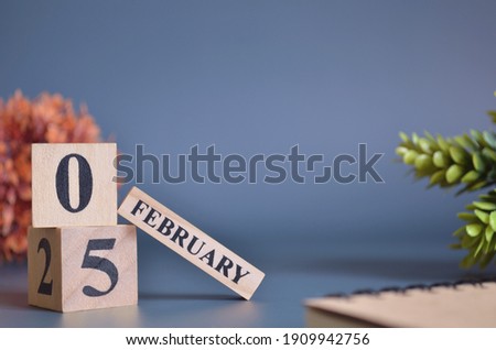 February 5, Cover in the evening time, Date Design with number cube for a background.