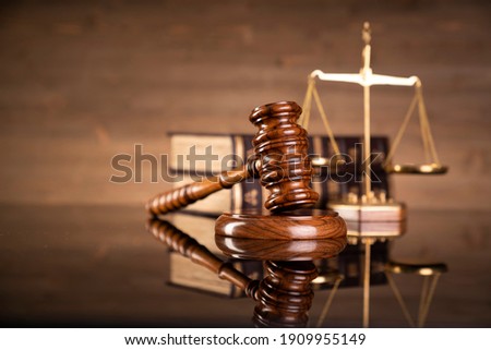 Justice legal and jurisprudence concept. Law books on lawyer desk at law firm. Royalty-Free Stock Photo #1909955149