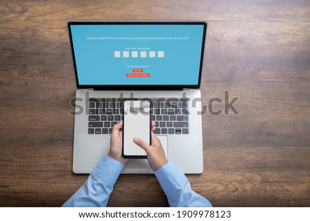 Woman  hand enter a one time password for the validation process, Mobile OTP secure Verification Method, 2-Step authentication web page. Royalty-Free Stock Photo #1909978123