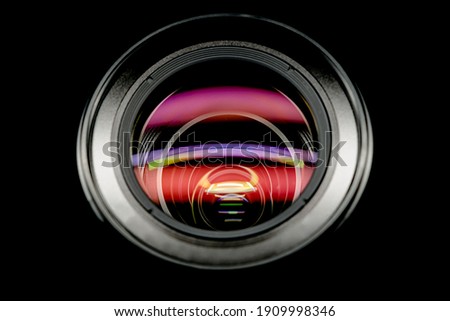 Photo Camera lens top view, isolated on black background