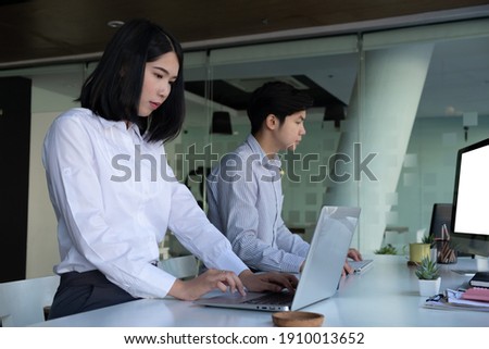 Business working on their assignment with laptop  in workspace